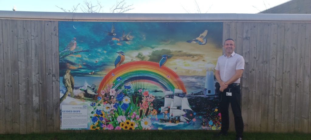 John Savage, associate director of Nursing and Quality at Ridgeway, with the new mural