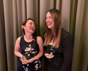 Dora Katalenac Zovk and Polly Snelling laughing with their awards.