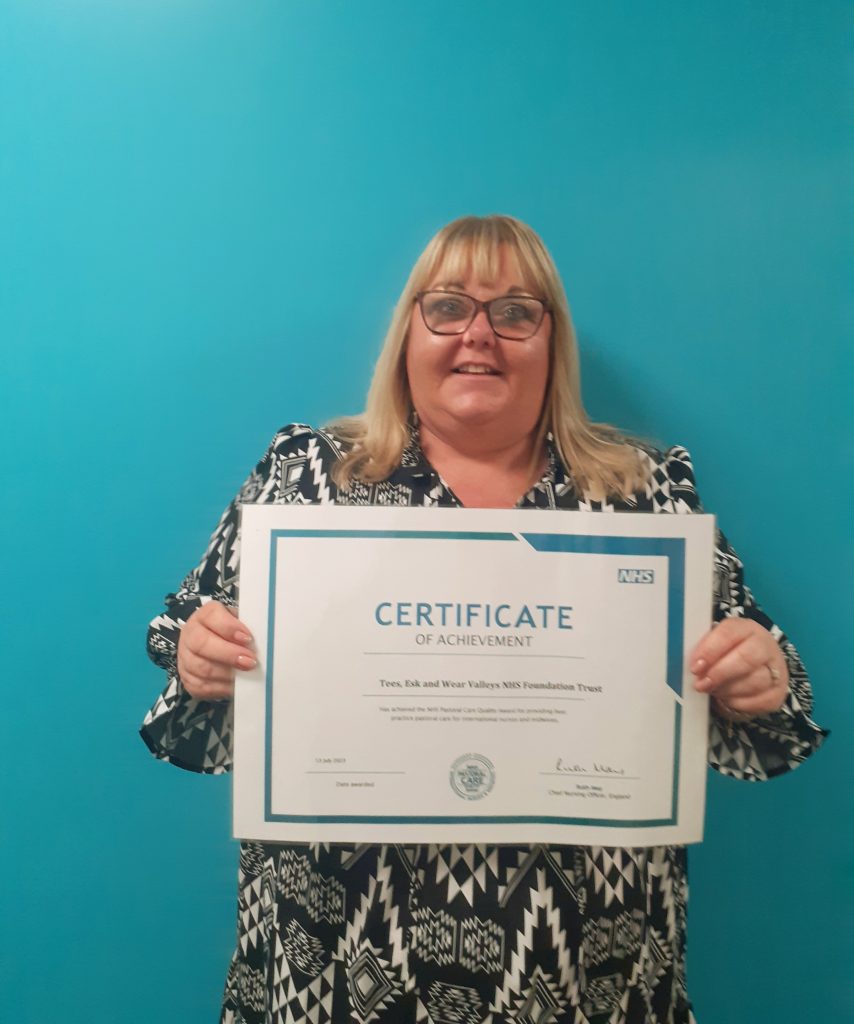 Karen Atkinson with her certificate