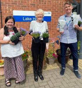 L-R Karen Dickinson, Judith Webster and Matt Bower help out the gardening group with some planting.