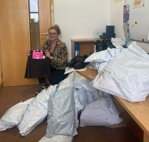Sophie Antill with some of the donated uniforms