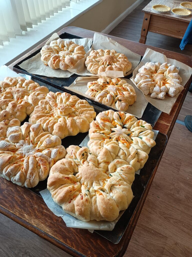 Care and share practice loaves made by patients.