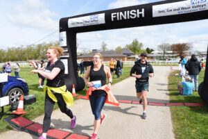 Runners crossing the finish line at the 2024 TEWV 10k