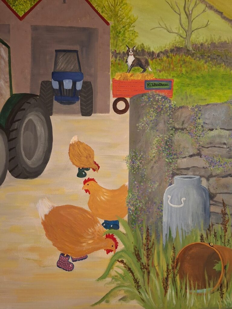 Close up of the brown chickens with wellington boots on their feet.