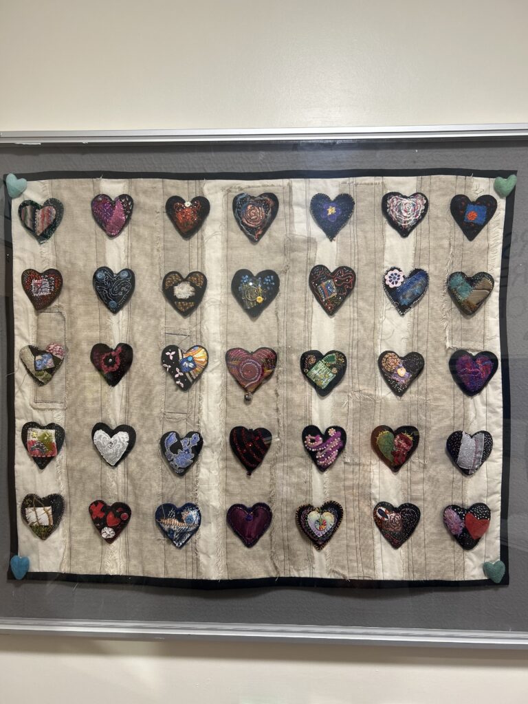 A display of a collection of the individual hand made hearts