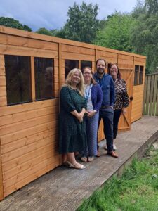 Durham CAMHS staff in front of shed