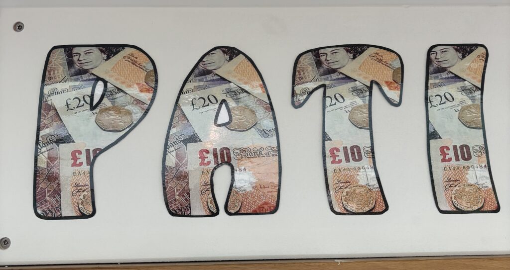 Close up of the Patients Bank sign showing more detail