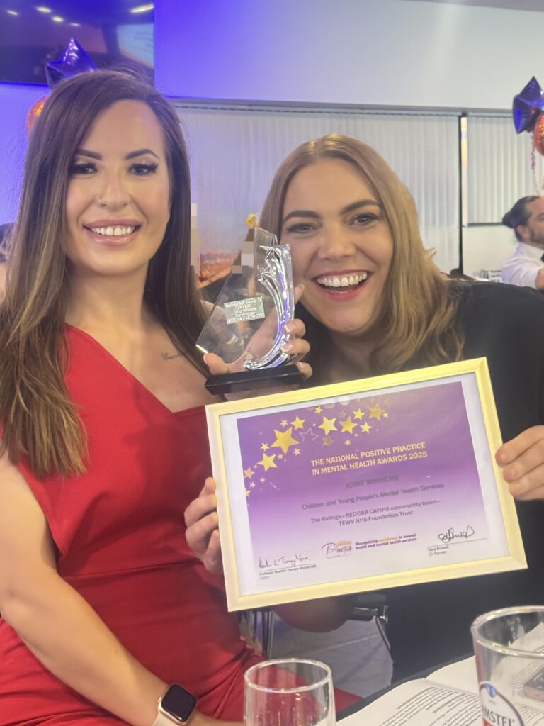 Staff from the Ridings CAMHS service in Redcar holding their certificate