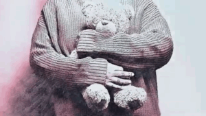 Mum cuddling a teddy when she feels overwhelmed.
