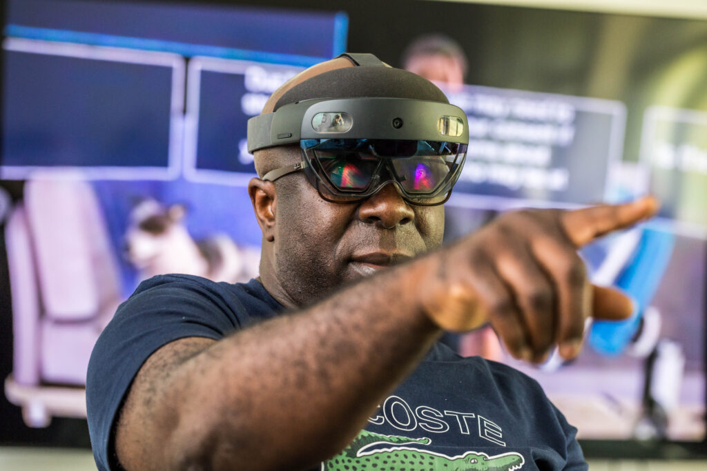 Samuel, previously student nurse, using the AR headset and app