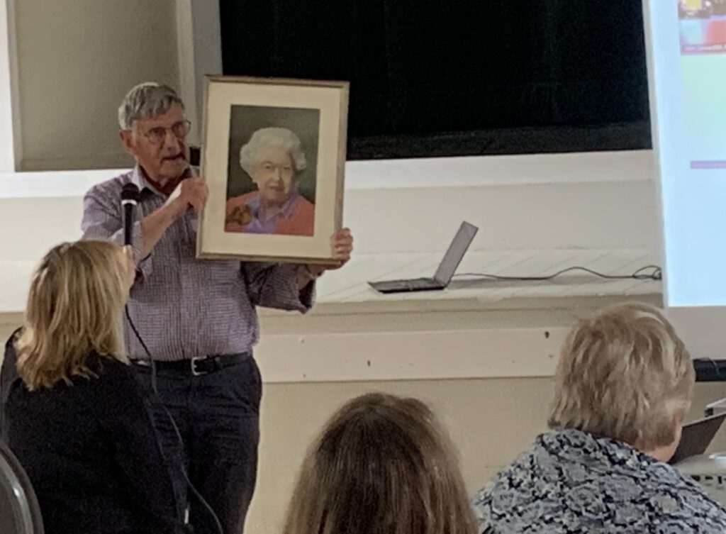 Bob shows off some of his art at a recent involvement community day.