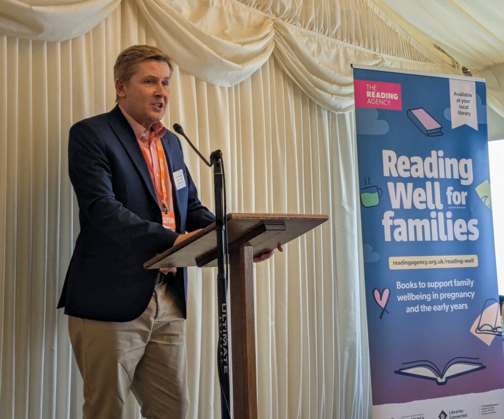 Paul Blenkiron speaking at the Reading Well for families launch.