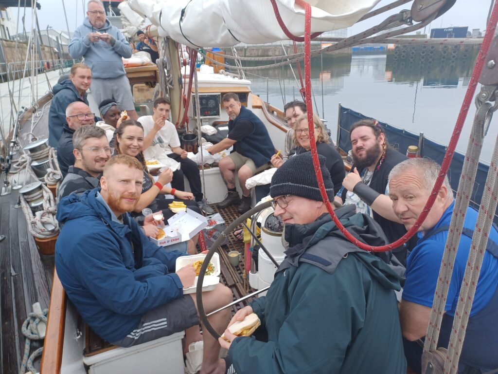The team enjoying lunch on their sailing adventure