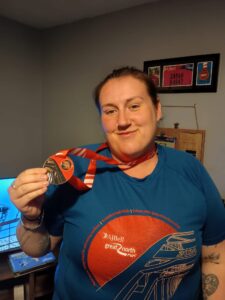 Sarah pictured with her GNR medal after the 2024 run.