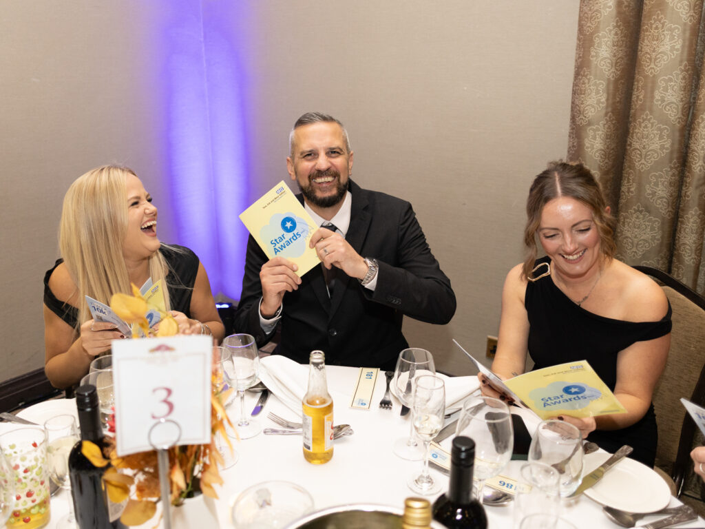 Star Awards guests reading the programme