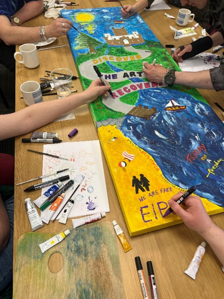 The Friday Group creating a piece of art