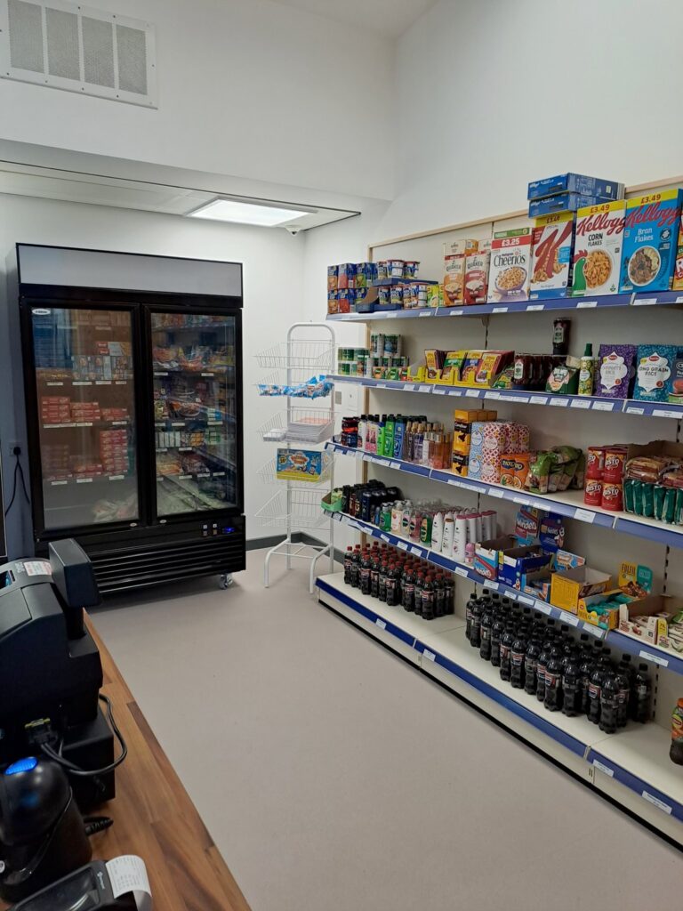 The Hive - shelving and produce in the shop