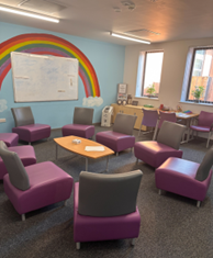 A group meeting room at The Glades with a table and 8 chairs