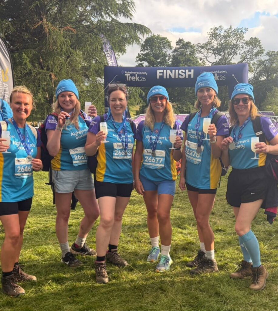 Poolie Plodders at finishing line of their charity trek