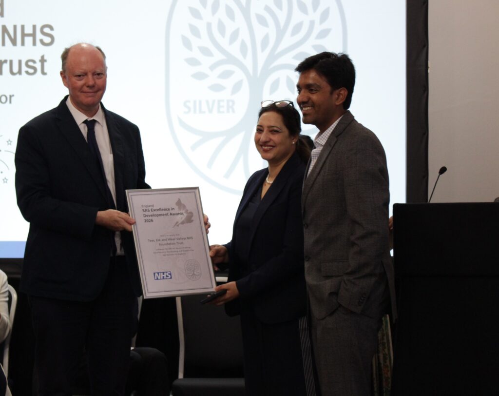 Colleagues being presented with the Silver Award certificate