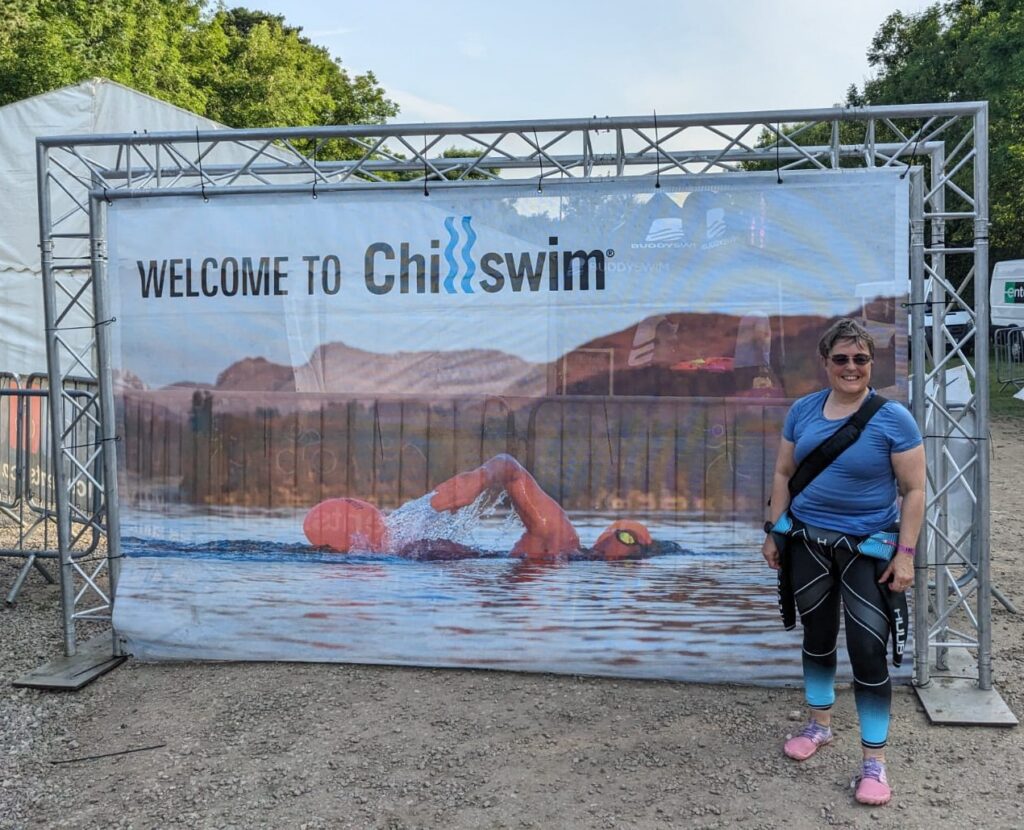 Christine next to the Chillswim poster