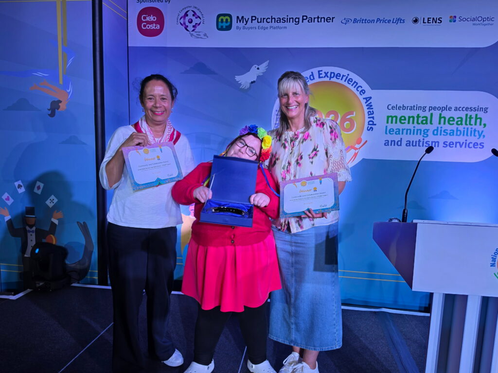 Anne Marie, on stage, receiving the Award at the National Lived Experience Awards.