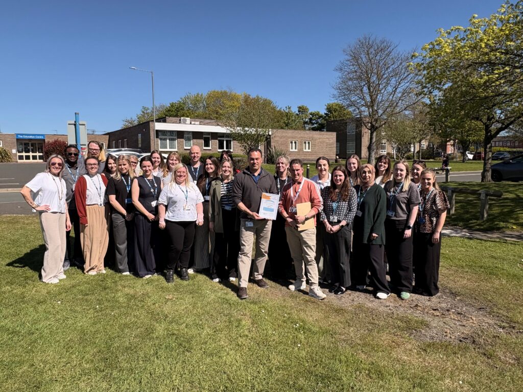 Getting help and mental health support teams in North Durham outside with their certificate