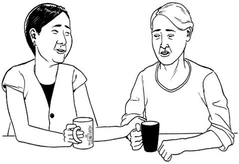 two people chatting with a cup of coffee