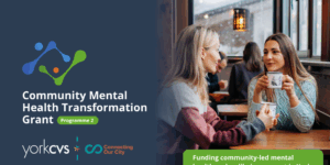 Image of two women talking with the words Community Mental Health Transformation Grant to the left hand side.