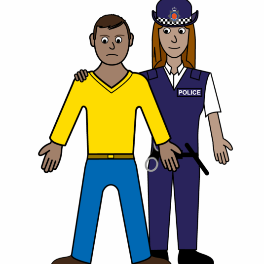 person stood next to a police officer. Police officer has their hand on their shoulder