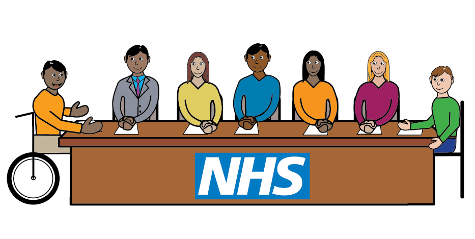 group of people sat around a long table talking