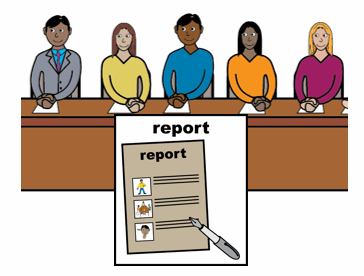 people sat at a long table with a copy of a report