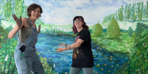 Griselda and Becca in front of the mural