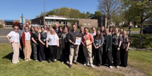 Getting help and mental health support teams in North Durham outside with their certificate