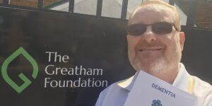 Michael Booth with his new leaflet on dementia